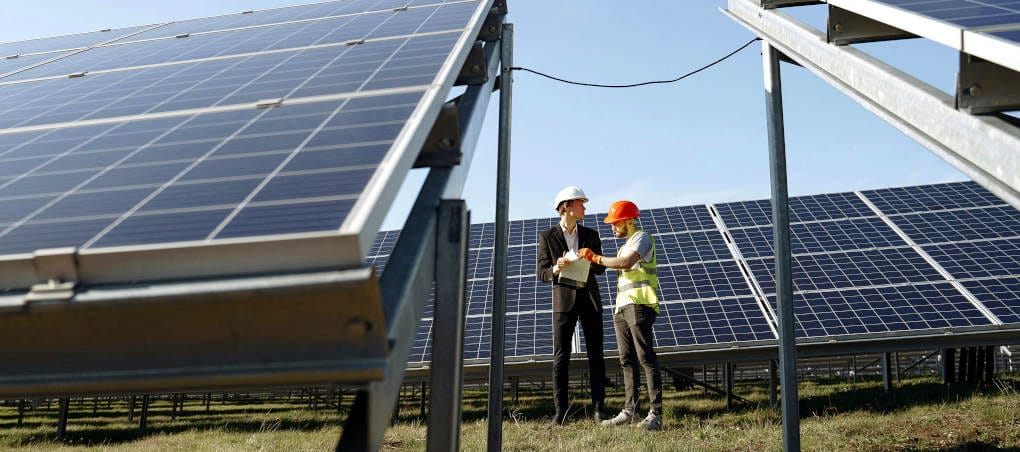 Standing between solar panels